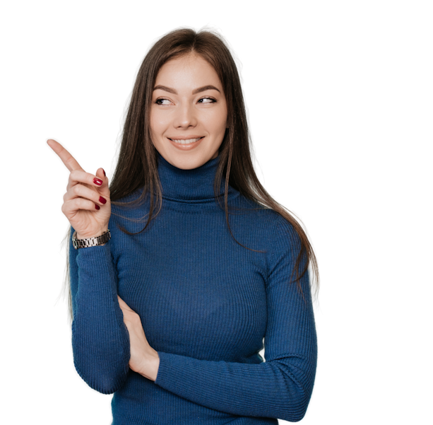 a woman in a blue sweater is pointing upwards